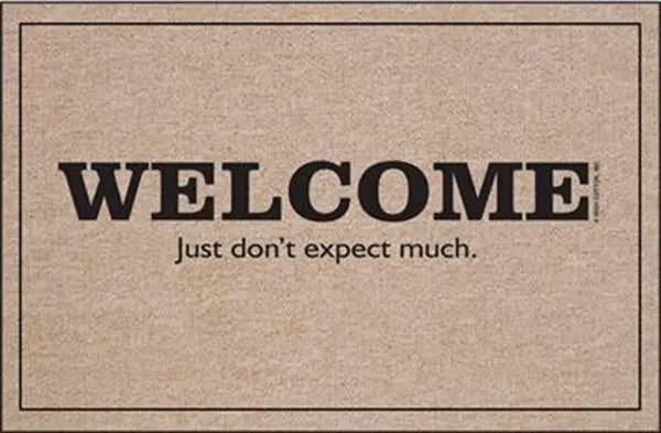 Self-Deprecating 'Welcome — Don’T Expect Much' Entry Mat 1